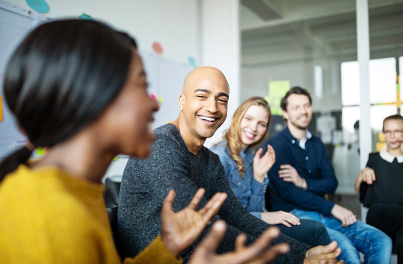 A group of people are engaging in an interactive discussion 