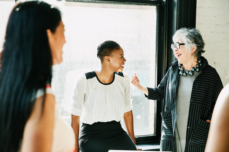 Two women engage in conversation