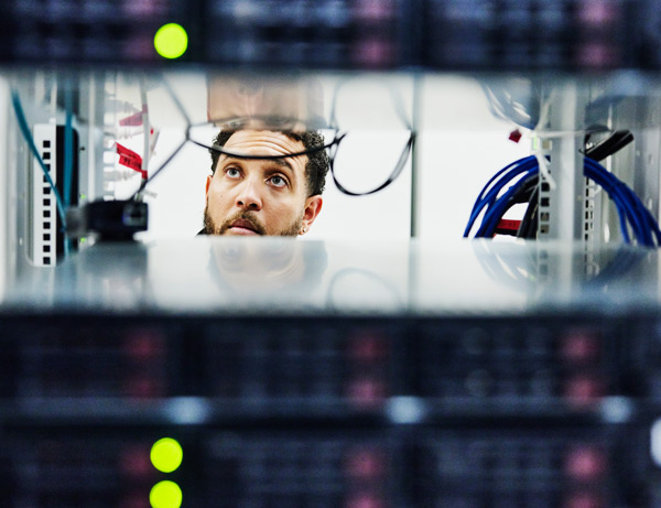 Man examines a computer server